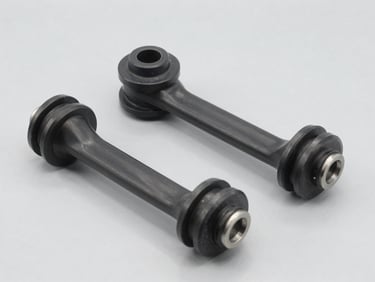 Crisp studio shot of automotive suspension rubber bushings and control arms, light gray background, sharp focus