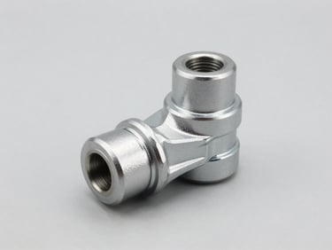 Crisp product photography of a metallic steering rack end joint on a neutral light gray background, sharp focus, technical detail