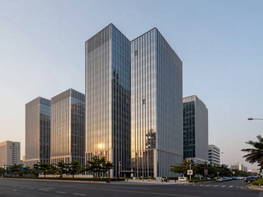 Sleek commercial building facades along Dwarka Expressway at twilight, sharp focus, clean modern lines.