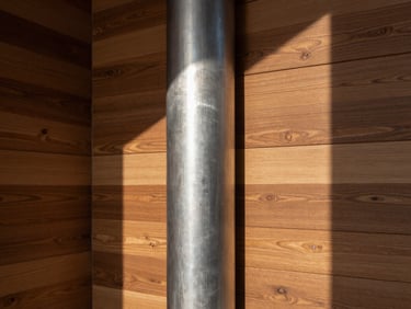 Detailed architectural photograph of Soya Miami custom wood paneling meeting a polished steel column, architectural lighting casting sharp lines across the textures.