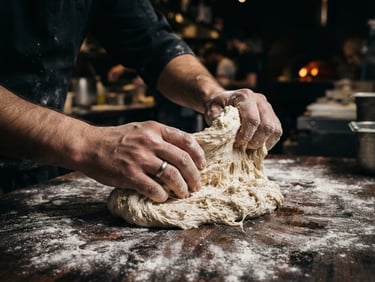 Macro close-up of hands preparing fresh dough in a busy pizzeria kitchen, sharp focus, high-contrast studio lighting, deep obsidian tones, 35mm