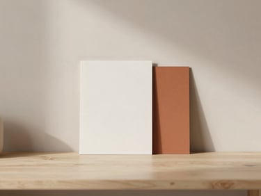 Minimalist workspace with structured stationery mockup, terracotta accent, soft diffused light