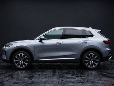 Side profile of a modern hybrid SUV parked on wet dark asphalt, dramatic high-contrast lighting highlighting sharp body lines.