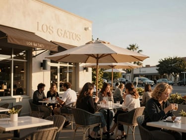 Warm golden hour shot of a sophisticated outdoor cafe patio in downtown Los Gatos, stylish patrons, soft natural light, editorial lifestyle photography.