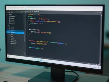 Close-up of clean, elegant Kotlin code displayed on a high-end development monitor, with soft teal and green ambient lighting casting sharp shadows.