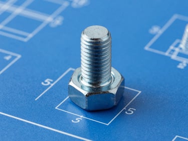 Technical CAD drawing of a custom hex flange bolt with precise dimension lines, blue blueprint background, crisp white lines