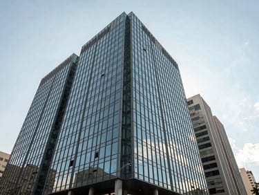 Wide angle shot of modern glass business architecture in Belo Horizonte, bright natural daylight, clean sky, structured lines.