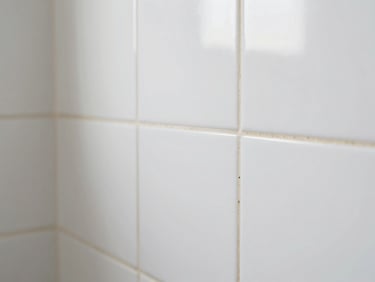 Close-up of clean, freshly restored tile grout lines in a bright modern bathroom.