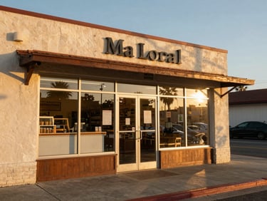 A warm, sun-drenched California streetscape with a local Hispanic bakery, golden-hour light reflecting off the glass, authentic neighborhood feel