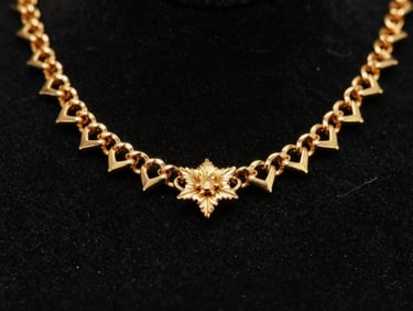 Macro photography of an intricate 22k gold bridal necklace, sharp specular highlights, deep obsidian background, shallow depth of field