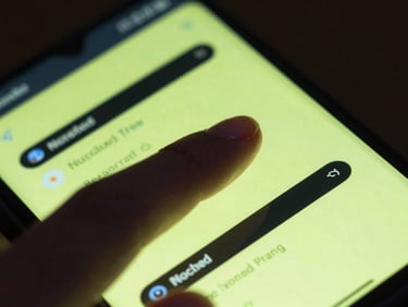 Extreme close-up macro shot of a finger tapping a high-refresh-rate Android screen displaying a sharp cyber-lime system dashboard, moody night environment with neon screen-glare reflecting on the hand.
