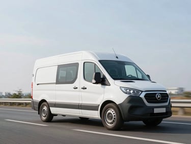 Dynamic low-angle shot of a modern white delivery van driving on an open highway, crisp morning daylight.