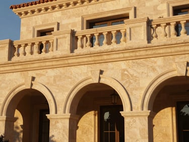 Crisp architectural detail of a premium Spanish-style villa facade, warm stone textures, elegant arched doorways, golden hour light