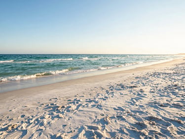 Vibrant wide shot of North Beach Clearwater, expansive white sand, gentle gulf waves, bright golden-hour sunlight.