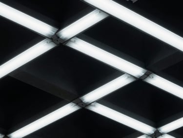 Abstract geometric schematic with deep shadows, emphasizing complex interconnections, cold fluorescent lighting, technical focus.