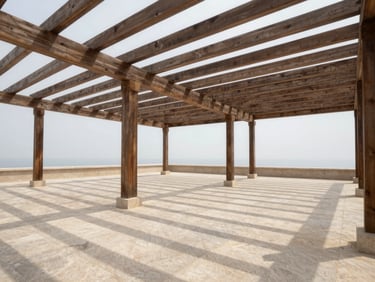 Wide environmental shot of an outdoor wooden pergola structure over a terrace, clean parallel timber beams casting parallel shadows on pale stone floor, overcast soft daylight, minimal outdoor setting, no people, no furniture clutter