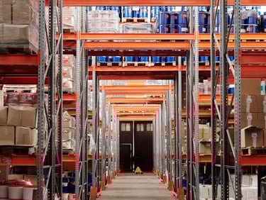 a warehouse style warehouse with a lot of shelves and boxes of boxes