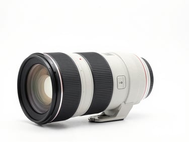 Professional 85mm f1.4 portrait prime lens, front glass element visible, clean white studio background, sharp details