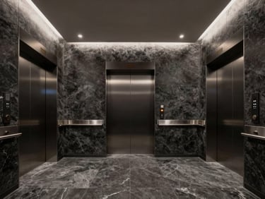 Wide panoramic shot of a private elevator lobby clad in dark charcoal stone, subtle recessed lighting, absolute symmetry.