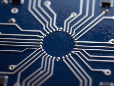 Extreme close-up macro shot of clean circuit traces on dark glass, cool silver highlights, deep cosmic indigo background