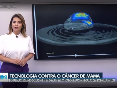 a woman in a white shirt and purple pants standing in front of a television screen