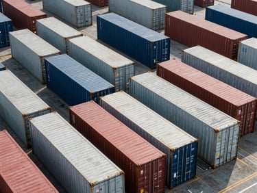 High-volume refrigerated container terminal at a major global port, precise rows of steel boxes.