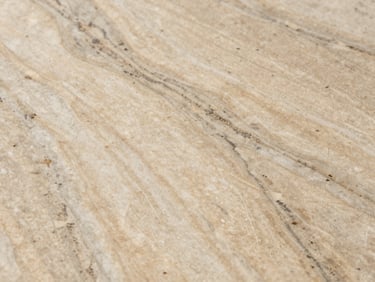 Macro studio photograph of a premium quartz slab surface, highlighting intricate warm beige and gray veining, crisp focus, architectural lighting.