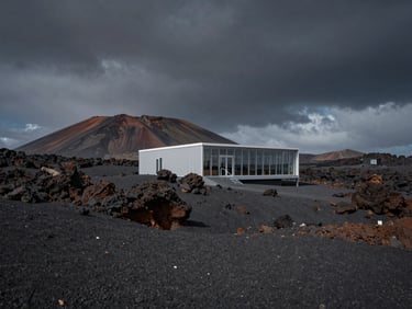 Cinematic wide-angle shot of a rugged volcanic landscape under a dramatic dark sky, a solitary modern architectural visitor center integrated into the rock.