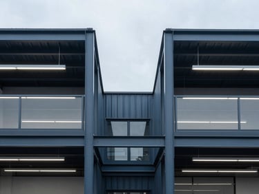 Symmetrical architectural detail of a modern clean industrial workspace with structured physical infrastructure, overcast daylight
