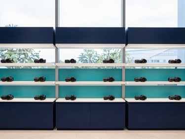 Bright modern retail interior with clean lines, professional atmosphere, natural daylight through glass windows, sharp focus, 35mm lens