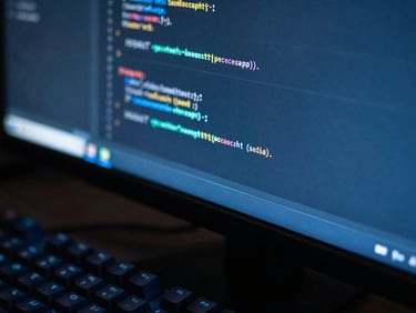 Macro shot of clean code on a curved monitor with cool blue screen glow, mechanical keyboard in soft focus, 35mm photography