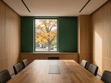 Warm minimalist meeting room in Toronto with oak wood panelling and a large window overlooking autumn trees, soft natural light, 35mm
