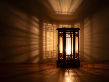 A multi-layered laser-cut projection lamp illuminated in a dark room, casting complex geometric shadows on a minimalist wall, warm amber light, high contrast.