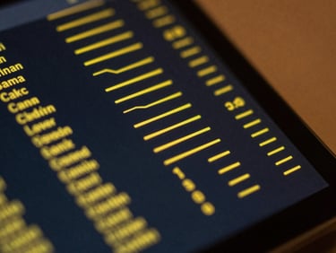 Macro close-up of a high-end dark mode data interface, clean yellow vector lines and performance metrics, soft warm ambient lighting, high contrast