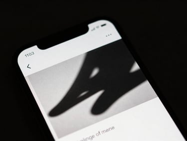 Extreme close-up of a mobile screen displaying custom social creative with high-contrast studio lighting, deep dramatic shadows, minimalist composition, 35mm film look.