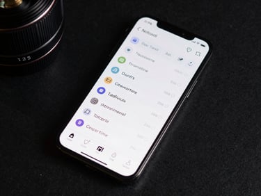 Close overhead flat-lay of an Android phone screen showing a clean task-management interface, cool studio strobe light revealing crisp UI type and icon grid, dark desk surface beneath