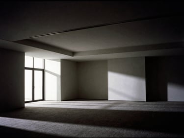 An empty modern press room with architectural lines, dramatic chiaroscuro lighting, deep shadows, sharp focus, 35mm film grain