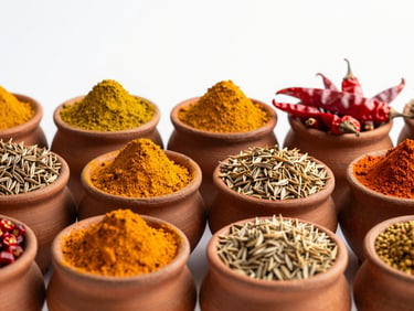 Vibrant Indian spices (turmeric, cumin, red chili) in small clay pots, bright natural daylight, rich organic tones, high detail, 35mm