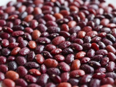Pile of deep red rajma beans, clean and dry, with soft natural lighting