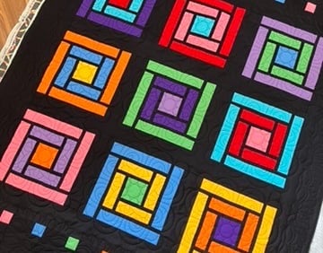 Colorful cabin windows quilt