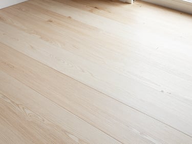 Overhead detail shot of interlocking natural white oak planks under bright Southern California window light, showcasing precise grain matching and minimal gaps.