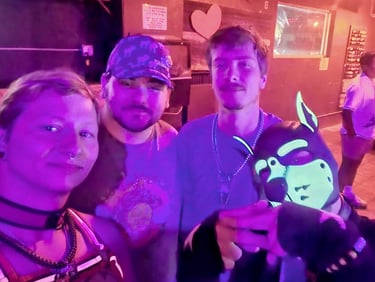 Four friends posing in a club.