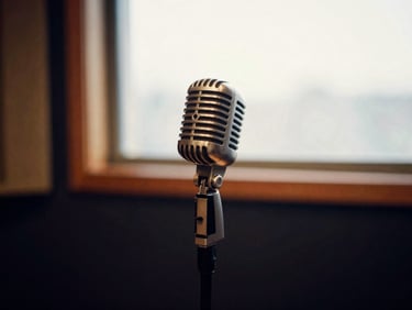 Vintage microphone in a quiet recording booth, warm tones, shallow depth of field