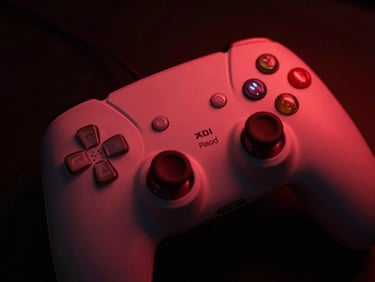 Tight macro shot of a sleek gaming controller under low red neon light, deep shadows, high-key contrast, atmospheric