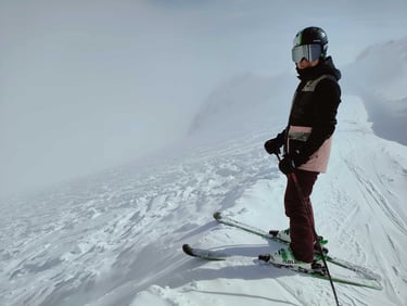 skier in a helmet on a snowy slope