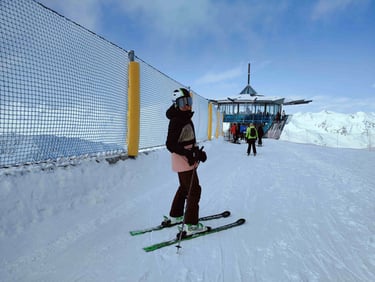 a person standing on skis in the snow
