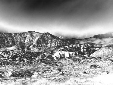 a black and white photo of a mountain range