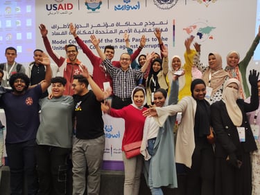 a group of people standing around a banner board