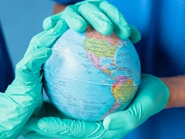 a person in gloves and gloves holding a globe