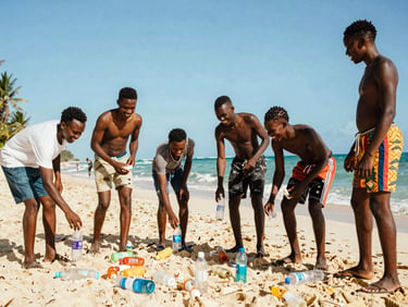 A group of Jamaican teenagers laughing while picking up plastic bottles on a beautiful tropical beach, bright sunny day, candid editorial shot.